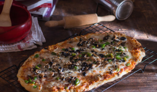 Large Vegetable Pizza - Our prepared pizza sauce with mozzarella cheese,mushrooms, olives and pepper

Preparation time 12 minutes