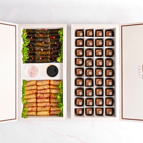 2 Boxes Offer - Belgian chocolate 36 pieces It consists of six fillings (Pistachio - Rocher - Lavello - Caramel - Cardamom - Lotus) Grape leaves with pomegranate molasses 30 pieces, musakhan 30 pieces