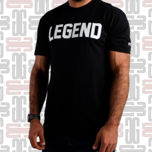 Rogue Legend T-Shirt - As seen at the inaugural 2019 Rogue Invitational, this athletic-fit black tee was designed for competitors in the CrossFit Legends division, and features the all-caps word LEGEND across the chest in white, with the Rogue logo on the left sleeve. The American-made Rogue Legends Shirt has a light and flexible cotton-poly blend construction. Material Type: 50% Cotton / 50% Polyester Care Instructions: Wash Cold, Dry Low