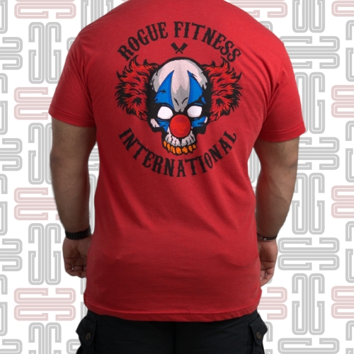 Rogue Halloween International T-Shirt - Rogue’s Halloween T-shirt in heather red with Rogue branding on the chest and an evil clown version of the Rogue Fitness International skull logo on the back. This men's / unisex athletic-fit crewneck t-shirt is made from a cotton-poly blend fabric that offers enough breathability and range-of-motion for the gym + ample comfort for casual wear.  Material Type: 50% Cotton / 50% Polyester Care Instructions: Wash Cold, Dry Low