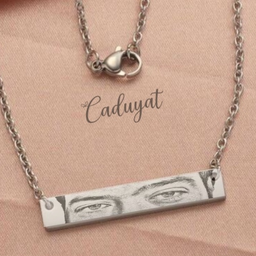 Caduyat  - Eyes Necklace - Laser Engraving - Steel gold plated necklace engraved 
 Lifetime guarantee on color and engraving 
 Please send the picture whats app or Email Caduyat@hotmail.com and details in the Notes