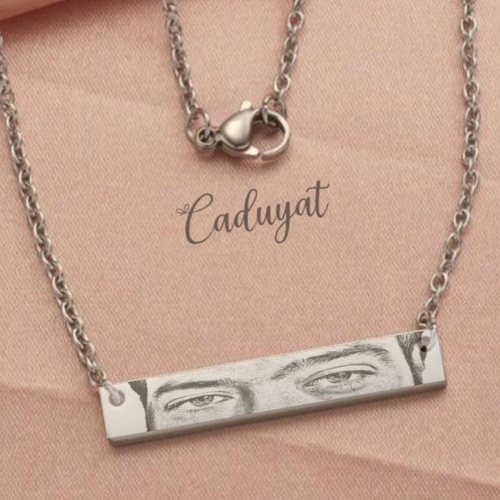 Caduyat  - Eyes Necklace - Laser Engraving - Steel gold plated necklace engraved 
 Lifetime guarantee on color and engraving 
 Please send the picture whats app or Email Caduyat@hotmail.com and details in the Notes