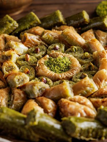 Mixed baklava - A luxurious selection of traditional baklava filled with nuts and sweetened with golden syrup, served fresh daily.