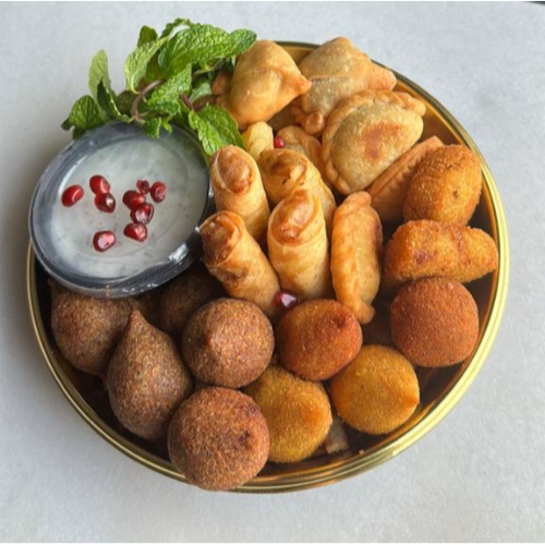 Qraish Dish (30 Mix Pieces) - 12 mix fried lebanese kubba
8 mix fried delicious yummi kitchen sambousak
5 Palestinians' musakhan rolls
5 Chinese spring rolls