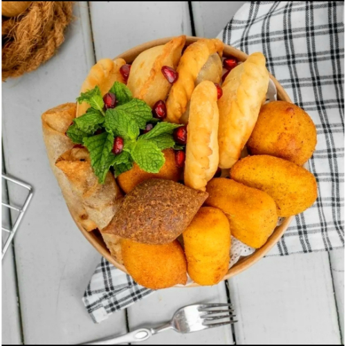 Snack Box (15 Pieces) - 2 borgol kubba , 1 potato meat kubba , 1 potato chicken kubba , 1 cheese halapino kubba , 1 cheese corn kubba , 1 kiri kubba , 1 fitta chili kubba , 1 meat sambousak , 1 fitta sambousak , 1 Akkawi sambousak, 1 labnah sambousak , 1 mozzarella and halapino sambousak , 2 musakhan