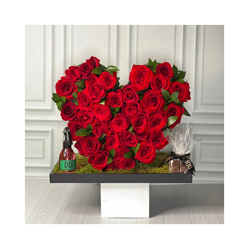 Roro - This heart shaped stand contains red roses and 150ml spray with chocolates.  Height: 40cm  Width: 45cm