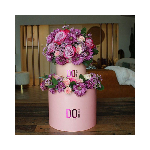 Gomo - Pink box contains purple chrysanthemum, purple roses, pink baby roses, wax flowers, green leaves. Height: 55cm Width: 45cm