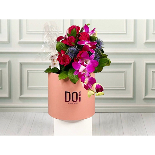 Lader - Pink box contains pink baby roses,  purple baby orchids with chocolates. Height: 25cm Width: 20cm