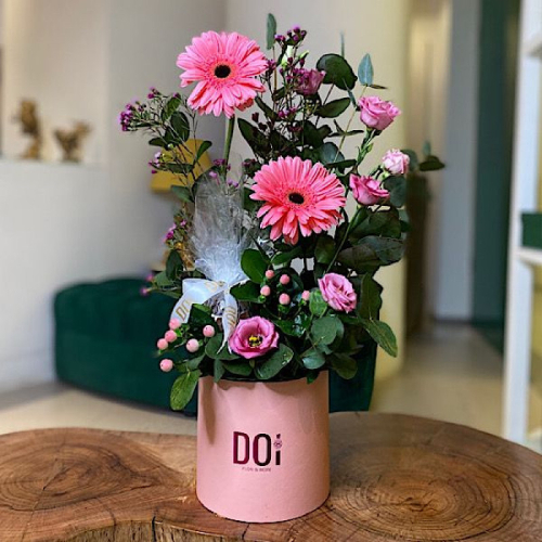 Doi Kwt  - Namaa 1 - Pink box contains pink baby roses, pink gerbera flowers, green leaves with chocolates. Height: 35cm Width: 15cm