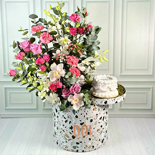 Barbie - Terrazzo box contains Pink Roses, Pink Carnation, Pink Hypericum, White baby orchid, White Cymbidium, Fuchsia and Pink baby roses and green leaves with mirror cake. Height: 70cm Width: 40cm