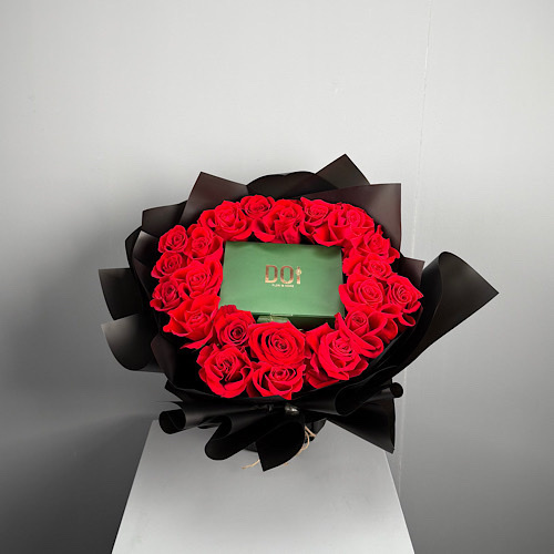 Dhai - Hand bouquet contains 25 pieces of red roses with box of Belgian chocolate. 
 height: 40cm width: 45cm