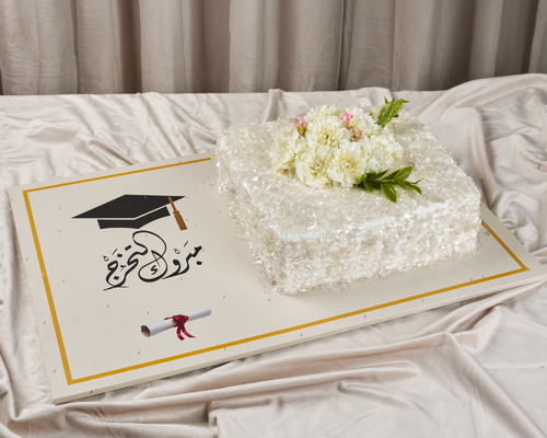 كيكة التخرج 1 - Vanilla and chocolate cake on a board. Congratulations on your graduation.
