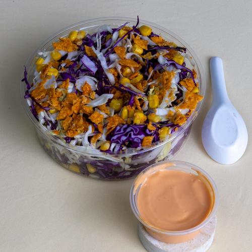 Nachos salad - lettuce with Green and red Gabbles corn yellow peppers Nachos potato with franchise dressing