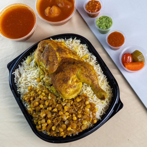 Machboos Chicken - half of chicken fresh with basmati rice roes water peesents with bhoth potatoes doqoos and Mabouch red green