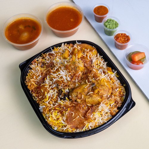 Chicken Mahrooq - half of chicken fresh with basmati rice potatoes eggplant corn flowers with tomato sauce bhoth doqoos Mabouch red and green