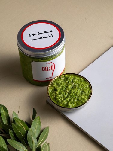 Green maabouj - Green chili peppers with garlic, coriander, spices, lemon, and olive oil.