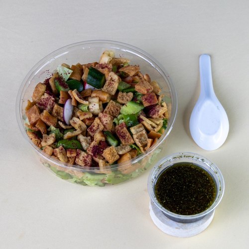 fattoush salad - lettuce with cocumber tomato Green pepper mint radish parsley with olive oil lemon mousse dressing