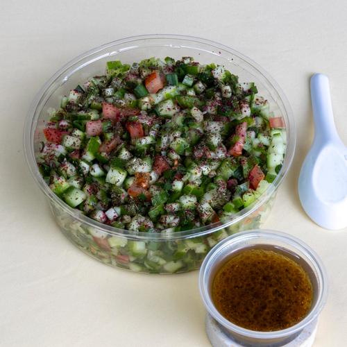 Shirazi salad - cucumber with tomato Green onion Green peppers mint sumac with oliv lemon dressing
