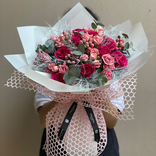 Fleurette - Pink blush - ِAn arrangement of flowers wrapped in pink mesh wrapping paper*Flower kind and color may slightly
differ based on availability.