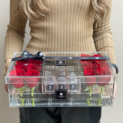 Prism RED - Our Signature rectangular box of red roses and chocolates Additional options: Ma'mool & Fleurette perfume 
 L 35cm * H 12cm*Flower kind and color may slightly
differ based on availability.