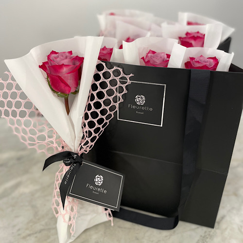 With love - A single rose wrapped with plain and meshed wrapping paper *Write the desired name in the message box*Flower kind and color may slightly
differ based on availability.