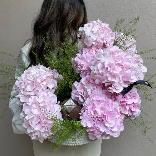 Pink Clouds - An arrangement of pink hydrangeas with chocolates in a concrete vase*Flower kind and color may slightly
differ based on availability.