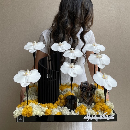 Mubkhar II - An arrangement of orchids with Modern mubkhar (height 28cm) with 3 tulles mamoul and chocolates 
*Flower kind and color may slightly
differ based on availability.