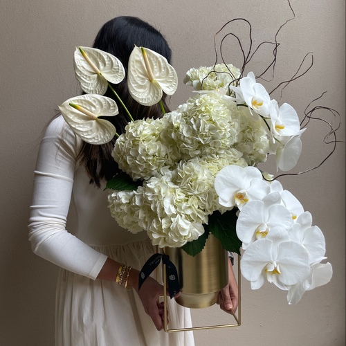 Golden beauty - An arrangement of flowers in a gold stand. *Flower’s color and kind may slightly differ based on availability.