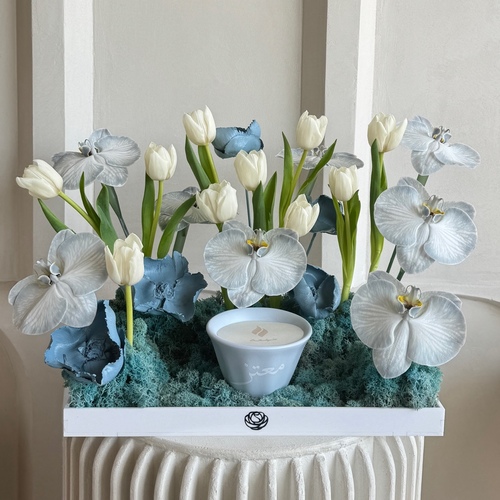 Fleurette - Baby breath - An arrangements of flowers with customized Shamaa candle in a white tray *Write the desired name on the candle in the message box *Flower’s color and kind may slightly differ based on availability