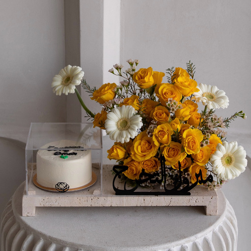 Sunkissed Cake - A tray that contains roses, gerberas and wax flowers along with a cake .
*write the desired name in the message box *Flowers color and kind may slightly differ based on availability
L 40 H 25