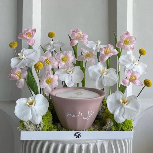 Garden of Eden Large - An arrangement of flowers with 21cm Shamaa candle *write the desired name on candle in the message box *flowers color or kind may slightly differ based on availability
