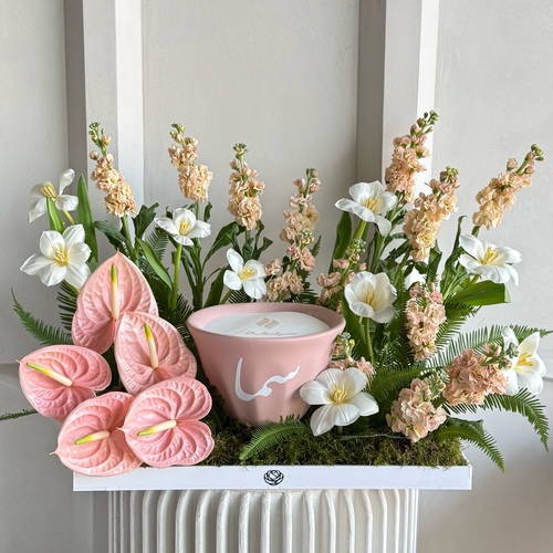 Peachy blooms - An arrangement of anthuriums, mithiola and tulips with 21cm Shamaa candle *write the desired name on the candle in the message box *flower kind and colors may slightly differ based on availability