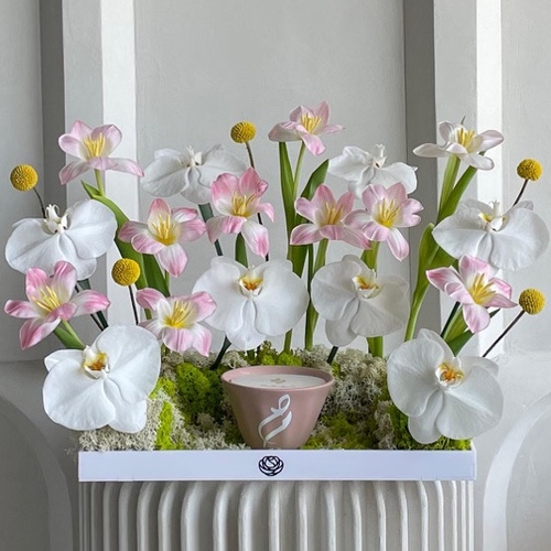 Garden of Eden - An arrangement of flowers with customized candle from Shamaa *Write the desired name on the candle in the message box*Flower kind and color may slightly
differ based on availability.