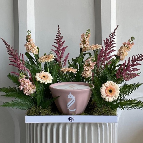 Heartfelt blooms - An arrangement of flowers with 21cm Shama candle *write the desired name on the candle in the message box *Flowers kind and color may slightly differ on availability