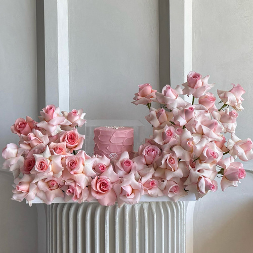 Pink Crush - Pink cake surrounded with pink roses with your choice of message on the cake L55 H45 *Flowers kind and color may vary based on availability