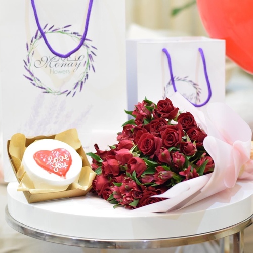 The Love Pink - It Is a Rose Bouquet Containing 12 Roses Of Baby Roses And Estumaria, Wrapped in Pink Paper , With a Love Cake , Enough For Two People, With 2 Red Helium Balloons.