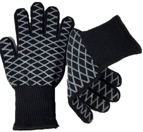 Gloves (Heat Resistant) - Introducing our Heat-Resistant Gloves, the ultimate solution for all your high-temperature needs! Whether you're grilling up a storm in the backyard, baking delicious treats in the kitchen, or working with hot machinery in the workshop, these gloves have got you covered. Crafted with premium heat-resistant materials, our gloves provide maximum protection against burns and heat exposure, allowing you to handle hot objects with confidence and ease. The durable construction ensures long-lasting performance, making them a reliable companion for all your cooking and industrial tasks. With a comfortable and flexible design, these gloves offer dexterity and grip, allowing you to handle hot items securely without sacrificing mobility. Whether you're flipping burgers on the grill or maneuvering hot pots and pans on the stove, these gloves offer unmatched versatility and convenience. Say goodbye to burns and discomfort – invest in our Heat-Resistant Gloves today and take your cooking and work safety to the next level!