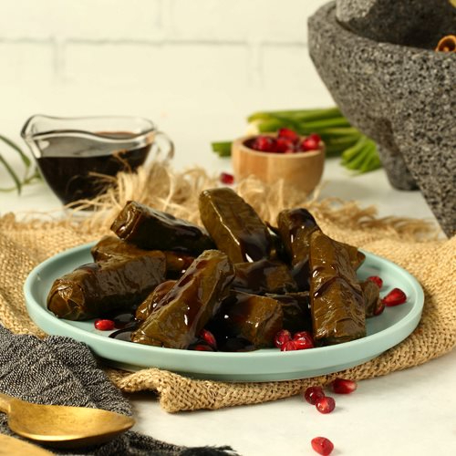 Pomegranate Vine Leaves - vine leaves stuffed with herbs ,rice & pomegrenate dressing