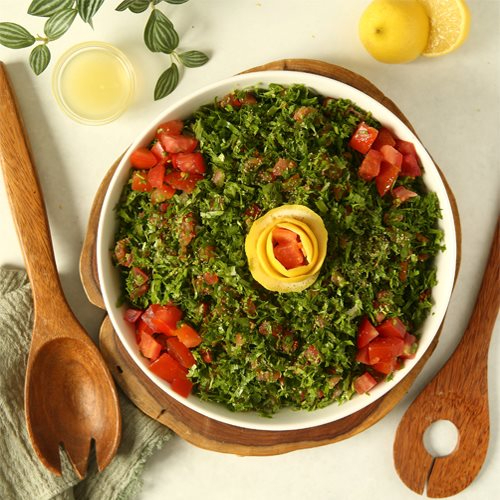 Tabbouble - fine chopped parsley with mint , tomato green onion & fine burghol , olive oil and lemon dressing