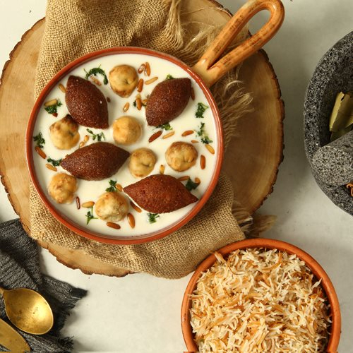 Basha & Asakro - fried kibbeh & shishbarak in garlic yogurt served with vermicel rice