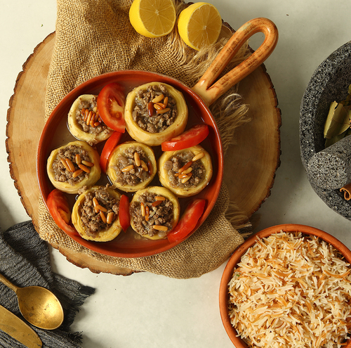 Stuffed Artichokes - Stuffed Artichokes with minced meat  with lemon and pomegranate sauce served with vermicelli rice