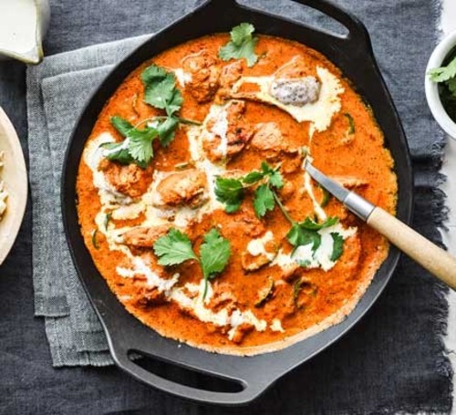 Butter Chicken - Tender Chicken cooked Creamy tomato , butter, cajun  sauce with aromatic spices