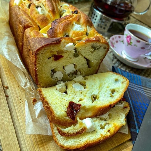 Babka Brioche Bread - Babka brioche bread, cheese, herbs and dried tomato with our special sauce