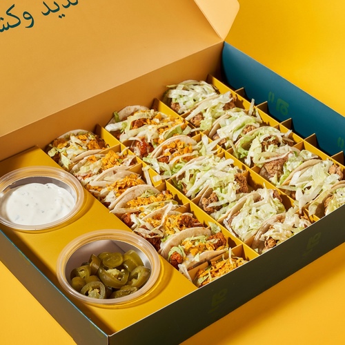 taco bites 21 pieces - A special box combining classic and buffalo flavors, served with crispy nachos and accompanied by Lapate’s signature sauce and spicy jalapeño. Seasoned and delicious, a taste everyone loves