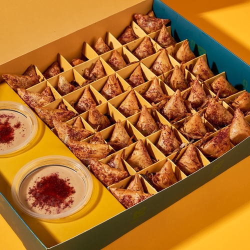 muskhan sambosa - Mini Musakhan Samosa stuffed with our delicious crispy mix, served with two special sauces: pomegranate molasses and our signature tahini sauce