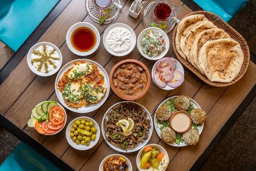 Breakfast for Four - Foul (as your Choice) Egg (as your Choice) Liver or Sausage -Falafel-Creme and Honey-Cheese  with Tomato-Labna-Mesakaa-Pickles-Onion-Bread    Available from 7:00 am to 12:00 pm