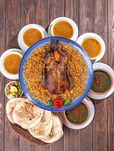 بطة كاملة مع ارز بالخلطة - بطة كاملة مع ارز بالخلطة مع 4 شوربة لسان عصفور و2 ملوخية والخبز والمخلل
