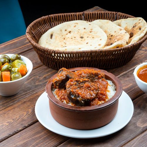 Beef Fata - Beef with bread fattah and white rice with tabliya's special tomato sauce.