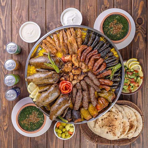 Eaters Box - 4 pigeons with mombar and mix mahashi, 4 kofta, 2 tawooq, 2Molokhia , basmati rice with salad,Tahina and garlic and bread and soft drinks