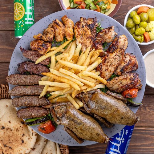 Egyptian Story - 2 pigeons 1 kabab 2 kofta 1 shish tawooq 1/2 grilled chicken with salad bread Tahina garlic and soft drink
